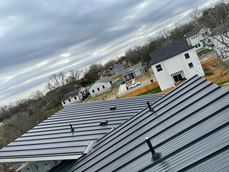 Standing seam metal roof panels with vents for Skylight Repair in Eau Claire